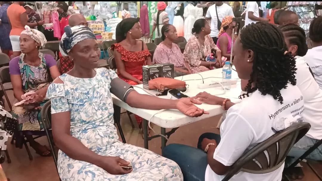 Community members receiving blood pressure checks