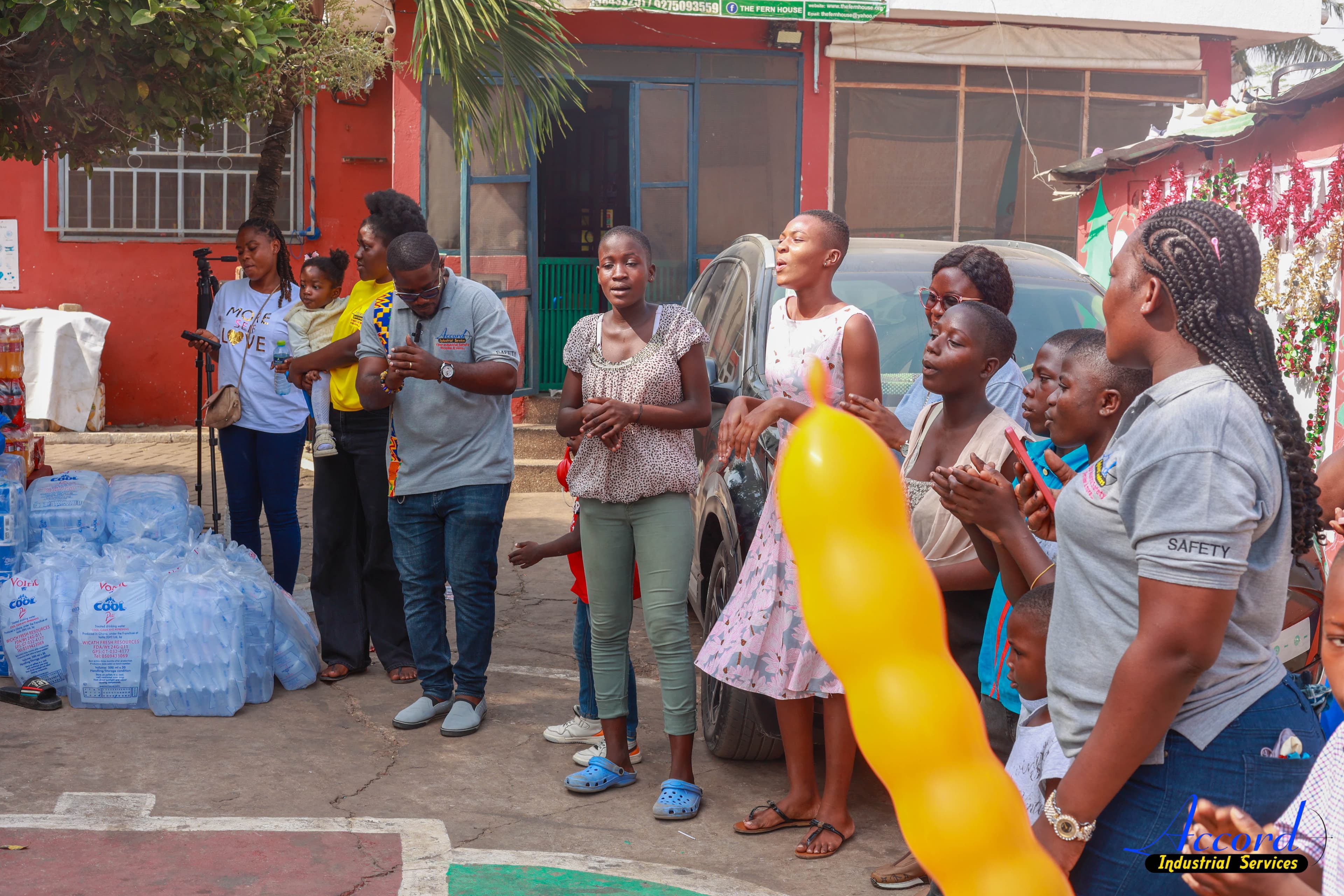 Accord team and Save Them Young children gathered during the donation visit